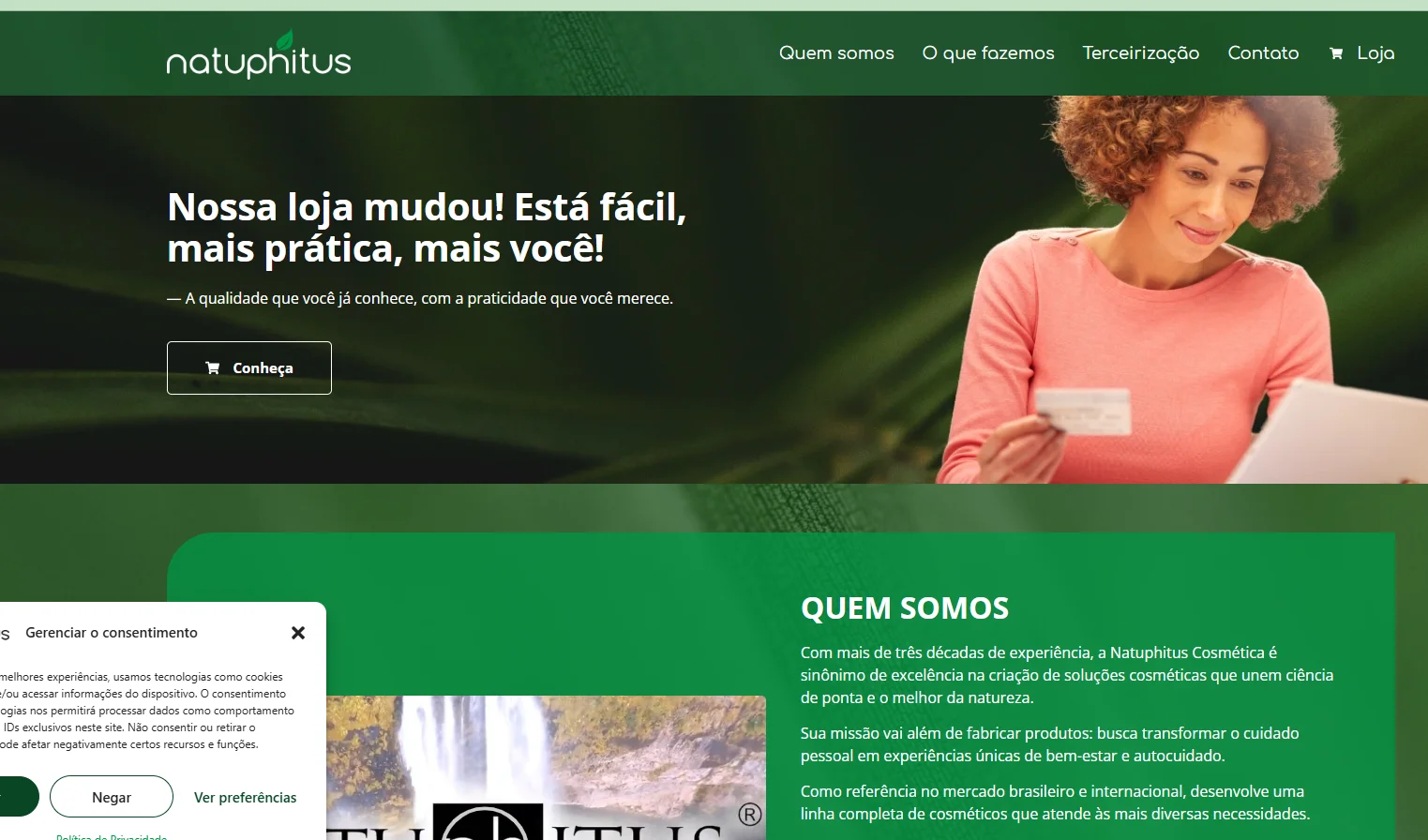 Landing page of the Natuphitus Cosmetics website showing a woman holding a card and paper with the tagline promoting a user-friendly shopping experience.